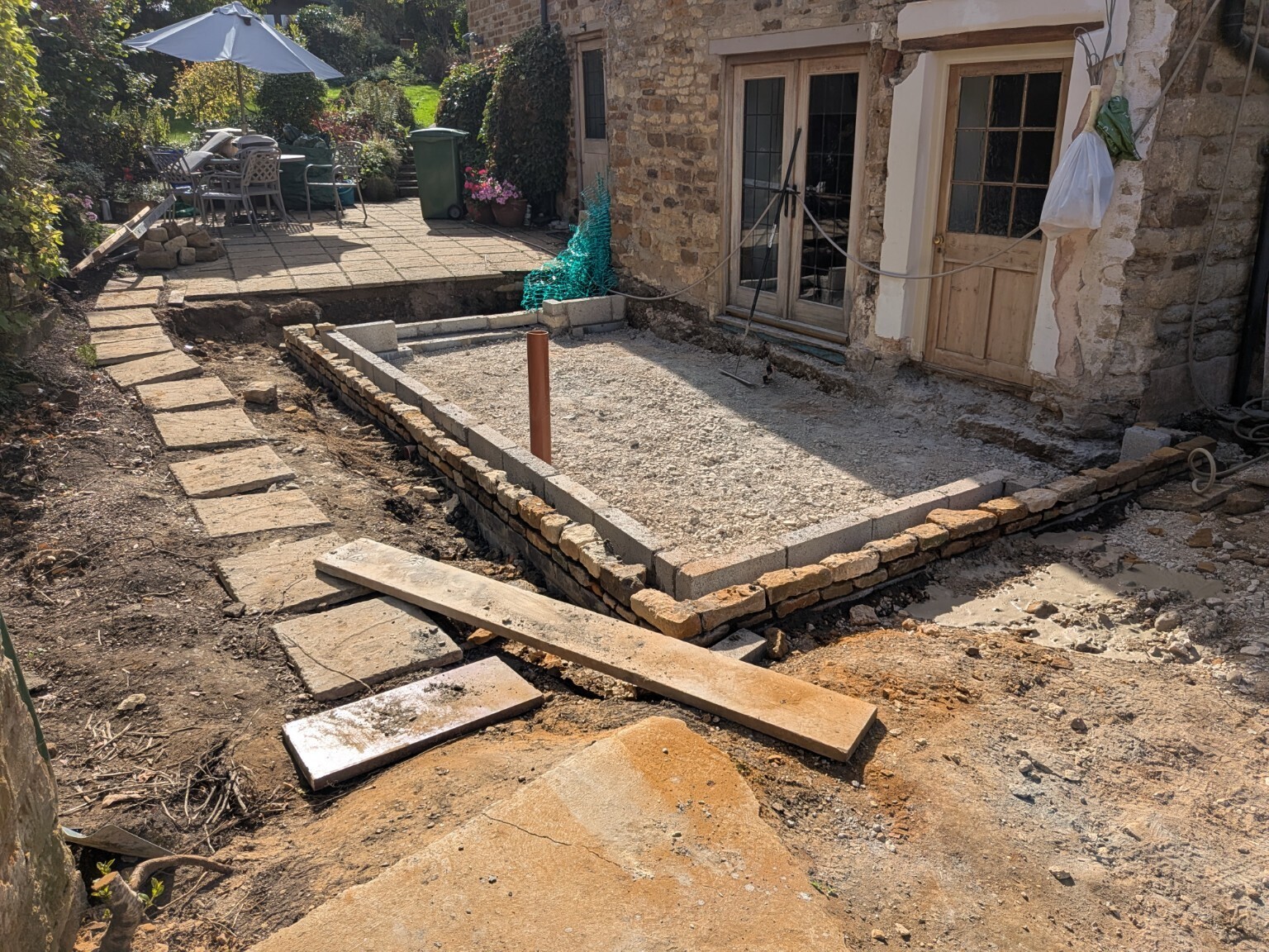 Prepared foundation and floor area for the stone extension